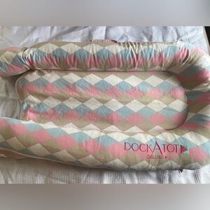 DockATot Deluxe Stage 1 with Pink and Blue Argyle cover 0-8 months